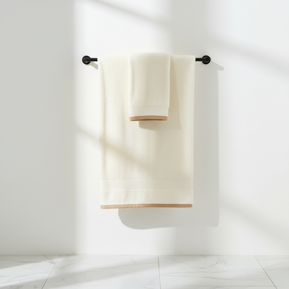Cream bath towel hanging on black towel bar modern bathroom