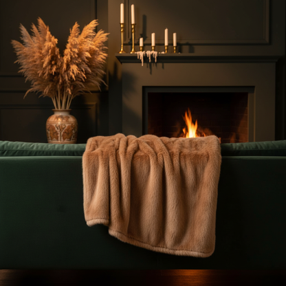 Faux mink throw on forest green velvet sofa fireplace autumn living room