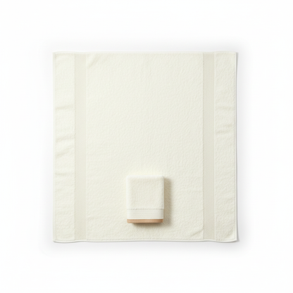 Cream bath towel flat lay overhead full size white background