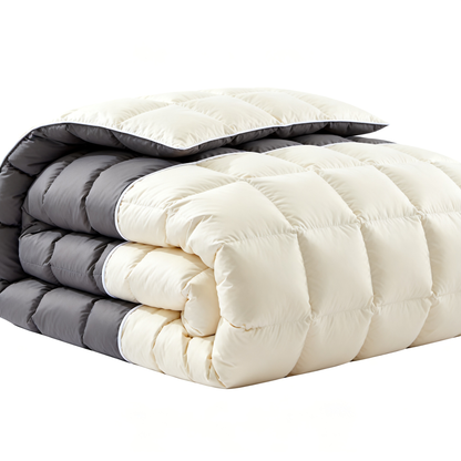 Reversible cream and charcoal comforter folded showing both sides