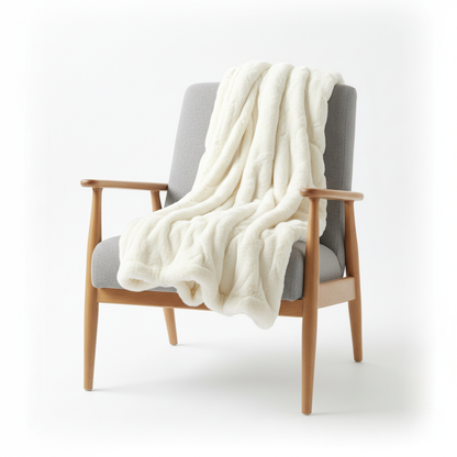 Cream faux fur blanket folded white background studio