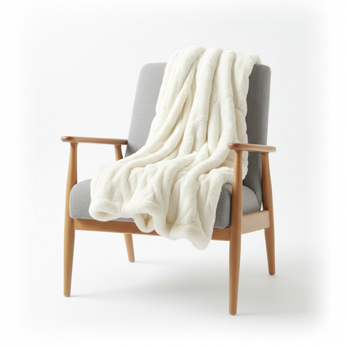 Cream faux fur blanket folded white background studio